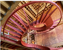 Curving red steel staircase shown in the original Steel Builders website