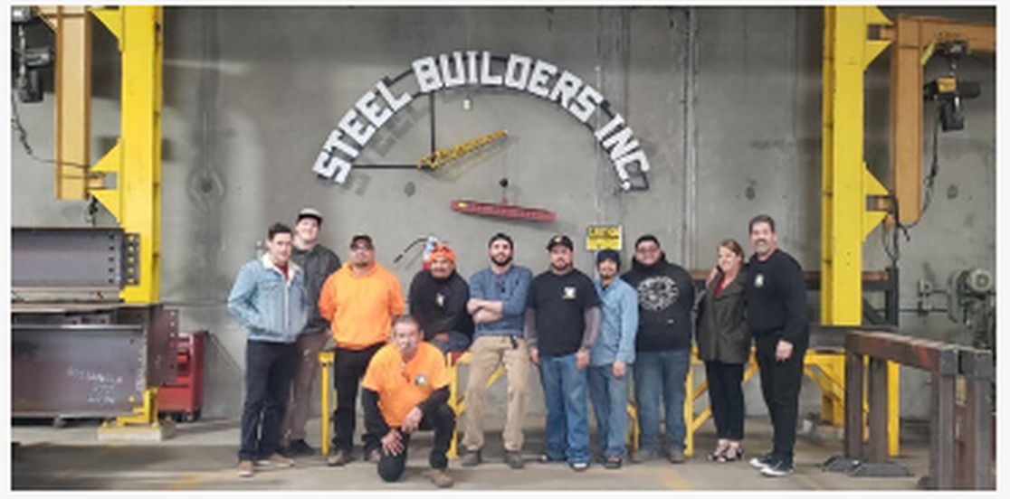Steel Builders family and team in their shop